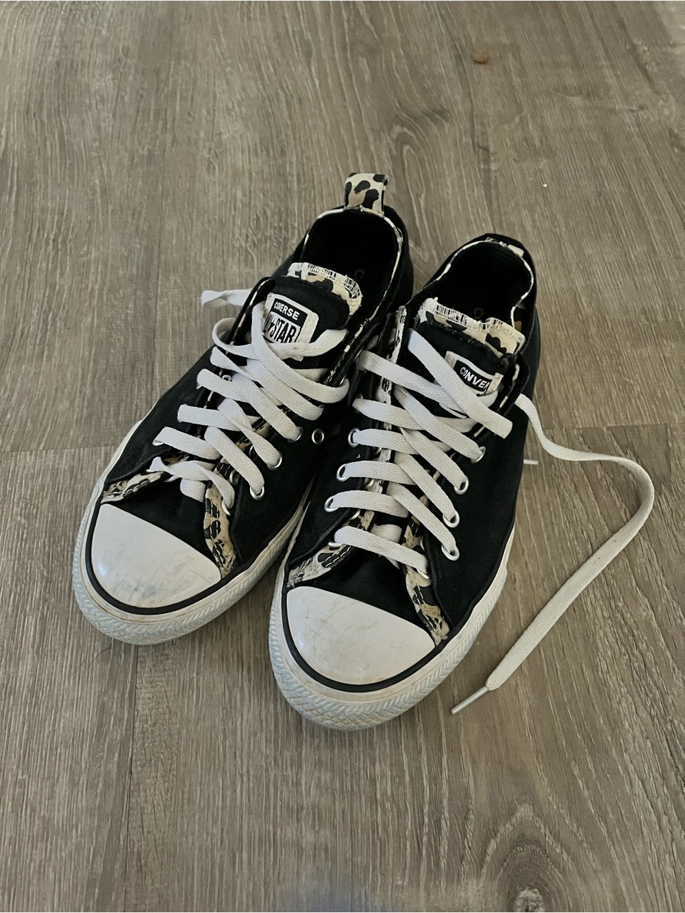 Converse black and white low top sneakers with leopard trim